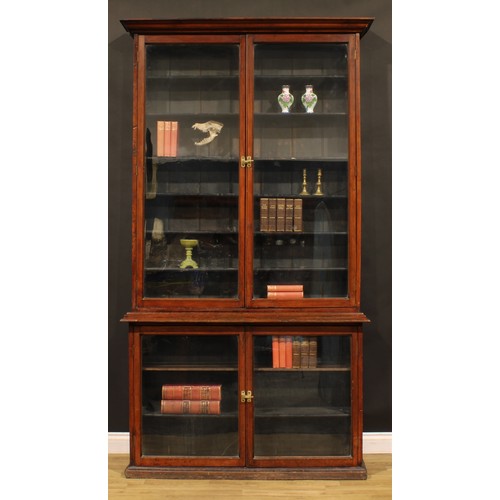 2157 - A late Victorian mahogany shop display case or library bookcase, moulded cornice above a pair of gla... 