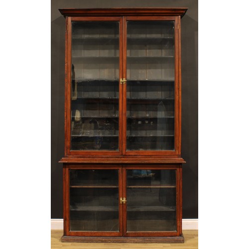 2157 - A late Victorian mahogany shop display case or library bookcase, moulded cornice above a pair of gla... 