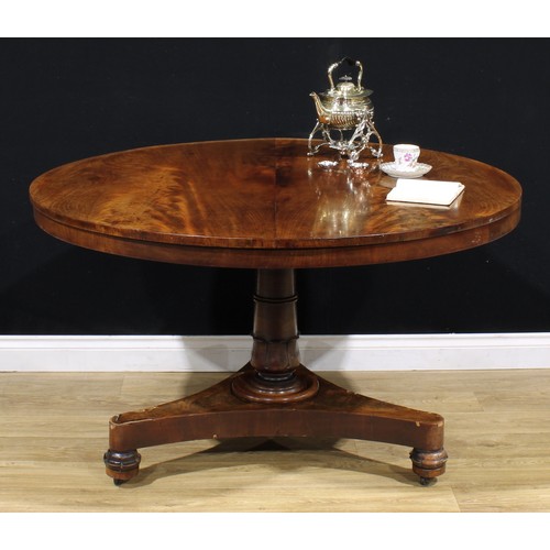 2168 - A William IV mahogany centre table, circular tilting top, turned column carved with lotus, incurve t... 