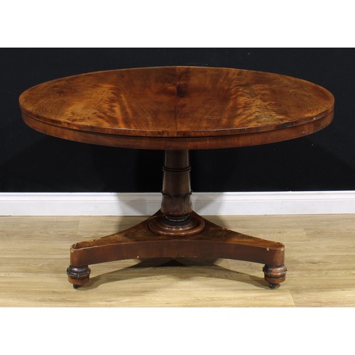 2168 - A William IV mahogany centre table, circular tilting top, turned column carved with lotus, incurve t... 