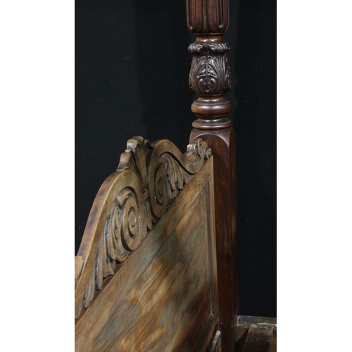 2170 - A William IV mahogany four-poster bed, outswept cornice, the headboard columns carved with stylised ... 