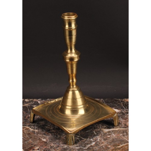 1938 - A Spanish brass tray base socket candlestick, knopped pillar, domed socle, fluted feet, 25cm high, c... 