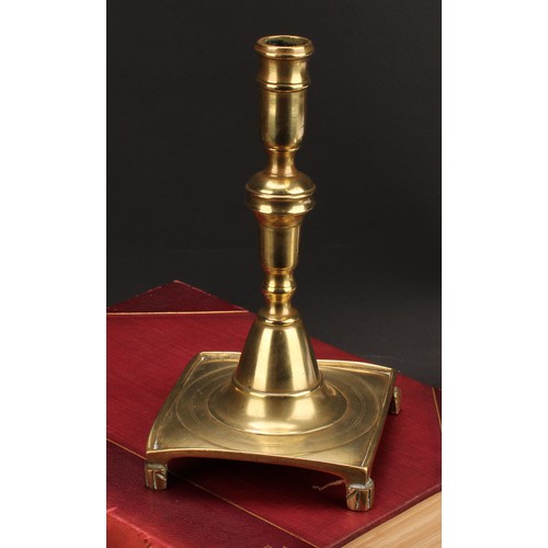 1937 - A Spanish brass tray base socket candlestick, knopped pillar, domed socle, fluted feet, 23cm high, c... 