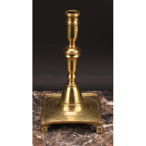 1937 - A Spanish brass tray base socket candlestick, knopped pillar, domed socle, fluted feet, 23cm high, c... 