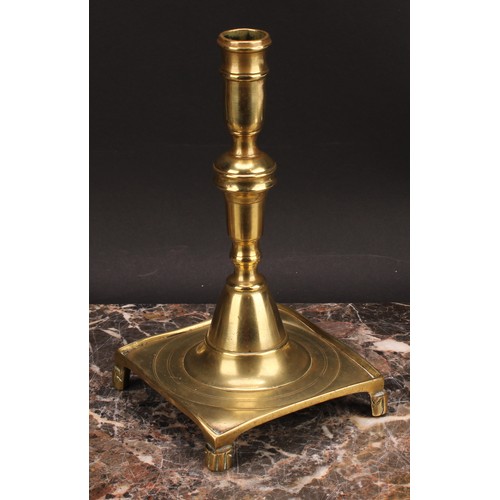 1937 - A Spanish brass tray base socket candlestick, knopped pillar, domed socle, fluted feet, 23cm high, c... 