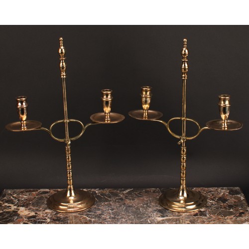 1945 - A pair of early 20th century brass two-light adjustable candelabra, orb-and-knop finiasls, broad dri... 