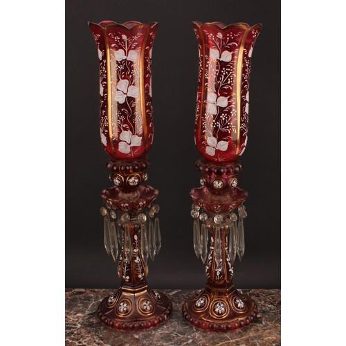 2188 - A pair of Bohemian cranberry flashed glass storm lantern candle lustres, decorated in opaque enamel ... 