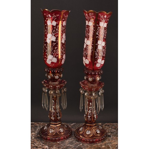 2188 - A pair of Bohemian cranberry flashed glass storm lantern candle lustres, decorated in opaque enamel ... 