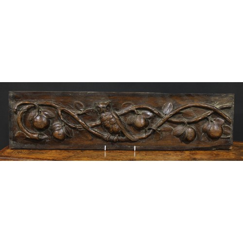 2186 - A pair of 19th century oak rectangular panels, each boldly carved with an owl amongst fruiting apple... 