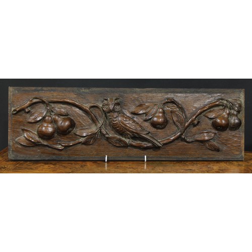 2186 - A pair of 19th century oak rectangular panels, each boldly carved with an owl amongst fruiting apple... 