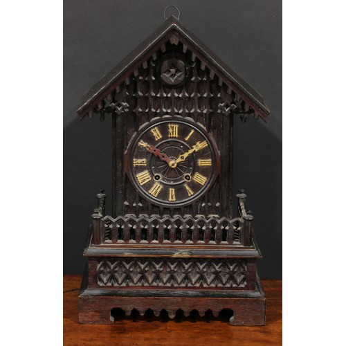 2252 - A Black Forest mantel cuckoo clock, 14cm dial applied with Roman numerals, twin winding holes, the a... 