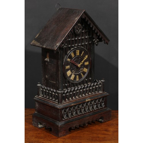 2252 - A Black Forest mantel cuckoo clock, 14cm dial applied with Roman numerals, twin winding holes, the a... 