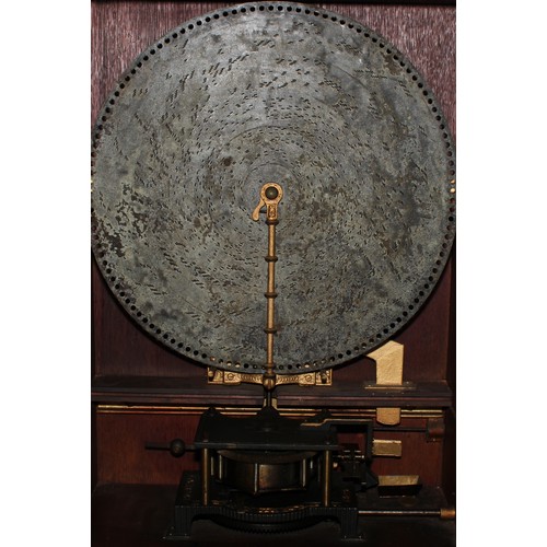 2236 - A 19th century coin operated penny-in-the-slot polyphon, the vertical movement playing 50cm discs, r... 
