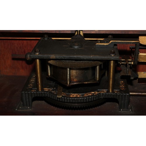 2236 - A 19th century coin operated penny-in-the-slot polyphon, the vertical movement playing 50cm discs, r... 