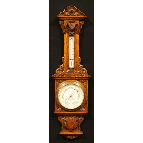 2259 - A late Victorian oak barometer, 18.5cm circular register inscribed FINNIGANS LTD, MANCHESTER, the ca... 