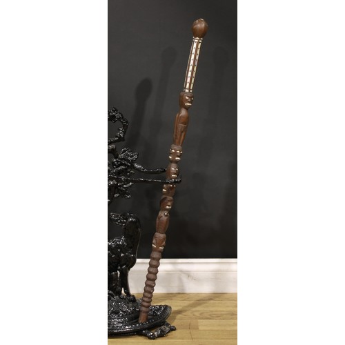 1508 - Tribal Art - a Polynesian hardwood staff or walking stick, carved with janus figures and faces, geom... 