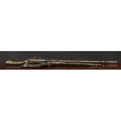 1493 - A 19th century Afghan flintlock jezail, 90cm barrel, full stock inlaid with mother of pearl, 126cm l... 