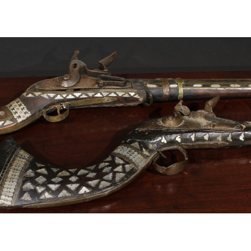 1493 - A 19th century Afghan flintlock jezail, 90cm barrel, full stock inlaid with mother of pearl, 126cm l... 