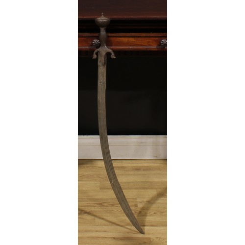 1497 - A 19th century Indian talwar, 72cm curved fullered blade with armourer’s mark, steel hilt with lotus... 