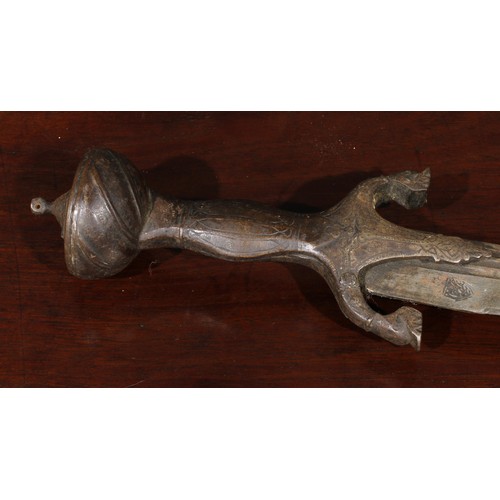 1497 - A 19th century Indian talwar, 72cm curved fullered blade with armourer’s mark, steel hilt with lotus... 