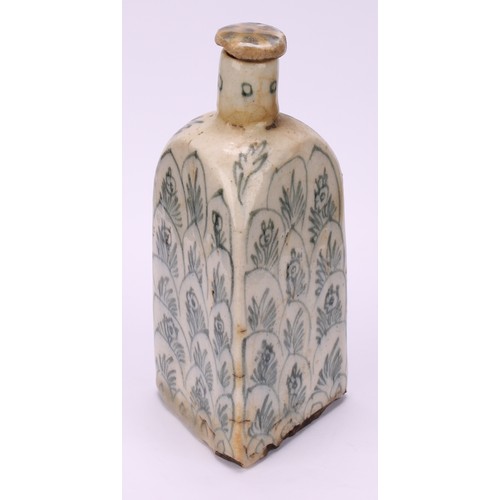 2 - A Middle-Eastern tin-glazed earthenware triform flask, decorated with flowers and layered lotus, 18.... 