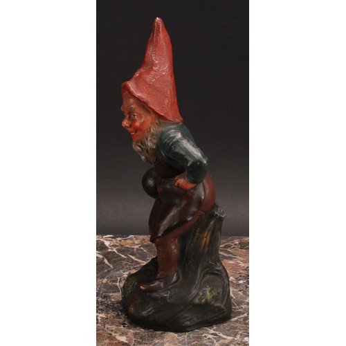 12 - An Austrian terracotta gnome, by Johann Maresch, he stands, beside a barrel, holding a bowling wood,... 