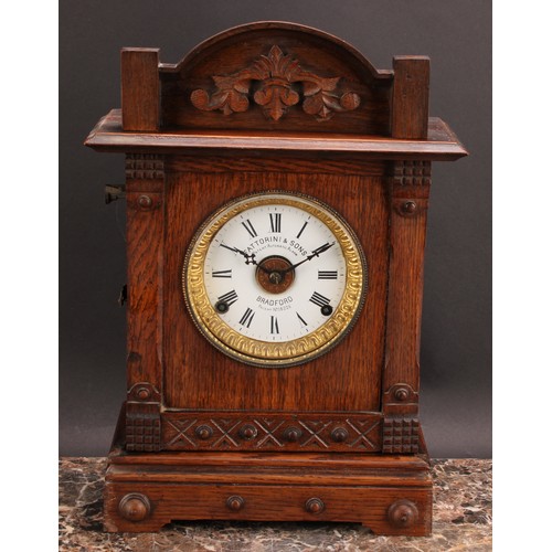 2488 - An early 20th century oak mantel alarm clock, 11.5cm circular enamel dial inscribed FATTORINI & SONS... 