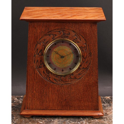 2447 - An Arts and Crafts oak mantel timepiece, 9cm circular dial decorated in mottled tones of orange and ... 