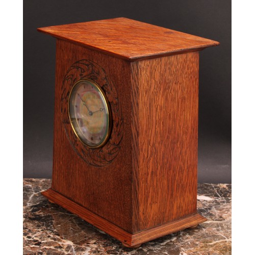 2447 - An Arts and Crafts oak mantel timepiece, 9cm circular dial decorated in mottled tones of orange and ... 