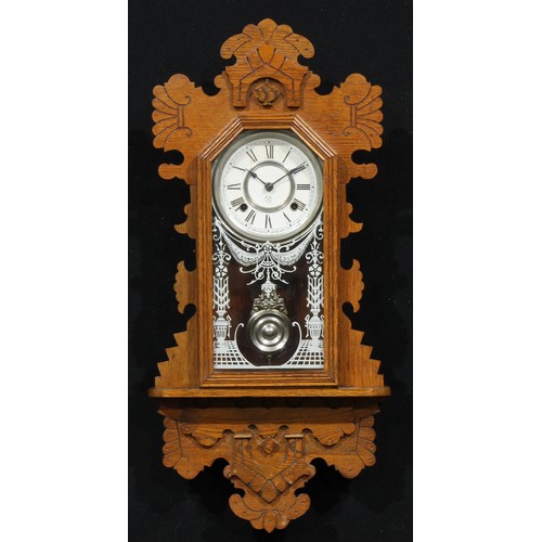 2452 - An early 20th century American oak gingerbread wall clock, by The Ansonia Clock Company, 13cm circul... 