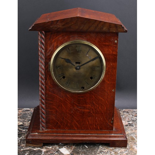 2492 - An early 20th century oak officer’s mess type mantel clock, 14.5cm circular brass dial inscribed C.W... 