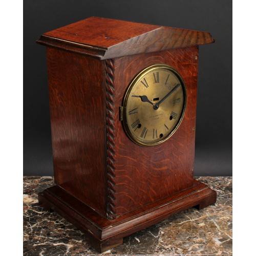 2492 - An early 20th century oak officer’s mess type mantel clock, 14.5cm circular brass dial inscribed C.W... 