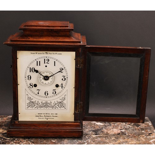 2485 - An early 20th century oak bracket or mantel alarm clock, John Bull Automatic Alarm, Patent No. 23106... 