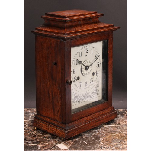 2485 - An early 20th century oak bracket or mantel alarm clock, John Bull Automatic Alarm, Patent No. 23106... 