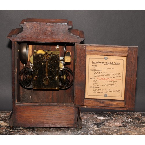 2485 - An early 20th century oak bracket or mantel alarm clock, John Bull Automatic Alarm, Patent No. 23106... 