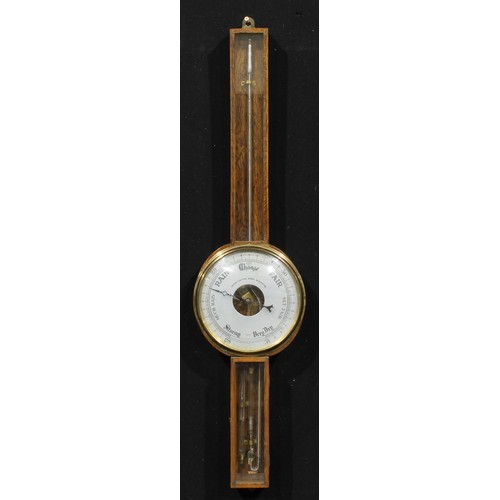 2503 - An early to mid 20th century oak wheel barometer, 19.5cm circular register inscribed DEMONSTRATION W... 