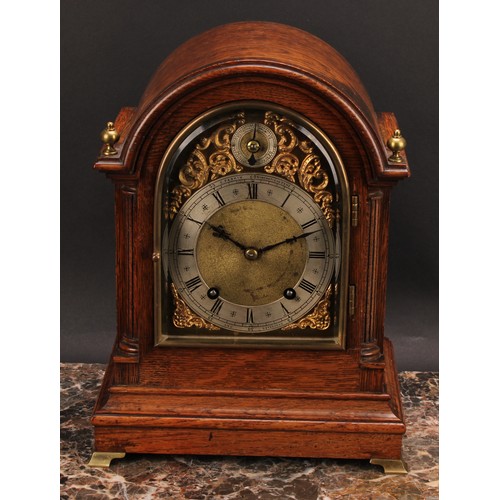 2486 - An early 20th century oak bracket-form mantel clock, 14cm arched brass dial with silvered chapter ri... 