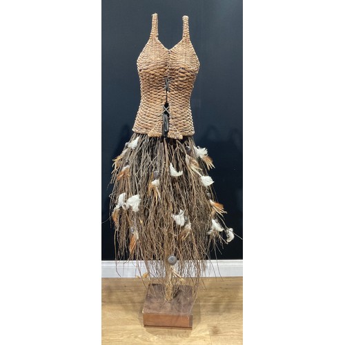 582 - A rustic wicker display mannequin, wicker bodice, hazel twig and feather skirt, on wooden stand, 160... 