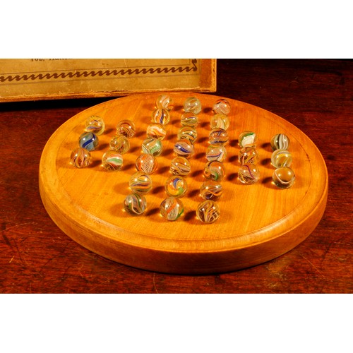 7091 - Parlour Games - a John Jaques & Son Ltd. circular solitaire board, comprising thirty three glass mar... 