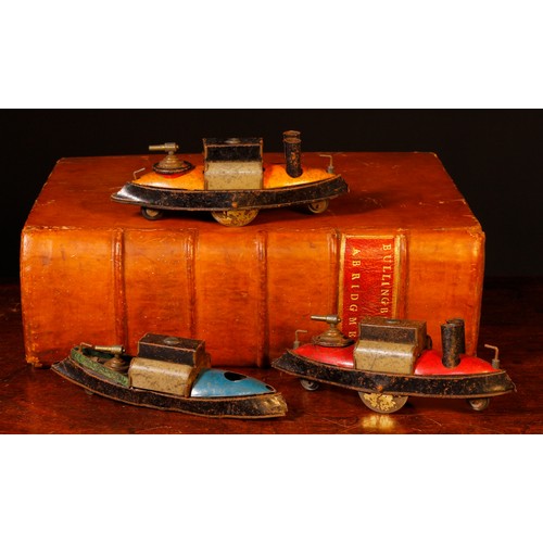 7093 - An early 20th century tinplate Penny toy, in the form of a warship on wheels, red, grey and black bo... 