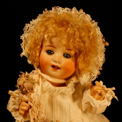 7104 - A Heubach Koppelsdorf (Germany) bisque head and painted composition bodied doll, the bisque head ins... 