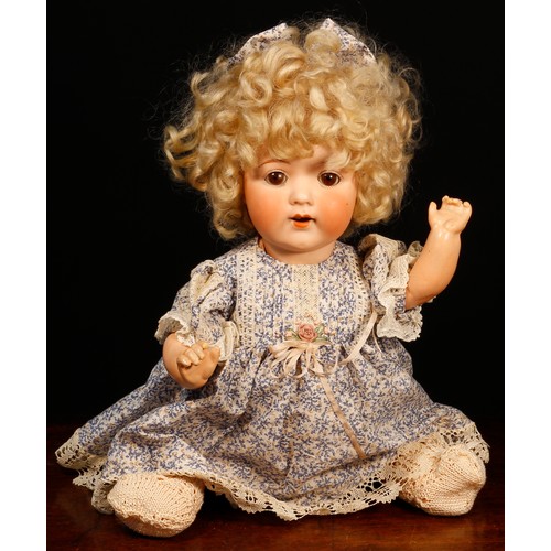 7109 - An Armand Marseille (Germany) bisque head and painted composition bodied doll, the bisque head inset... 