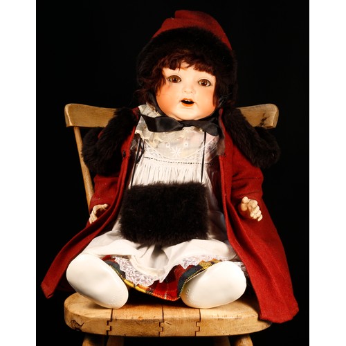 7114 - A Heubach Koppelsdorf (Germany) bisque head and painted composition bodied doll, the bisque head ins... 