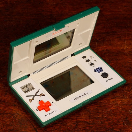 7138 - Retro Gaming & Technology - a Nintendo Zelda 'game and watch' multi screen gaming device, Model No.Z... 