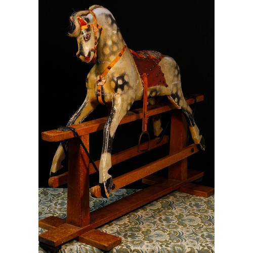 7119 - An English wooden rocking Horse, of small proportions, probably manufactured by Collinson & Sons Liv... 