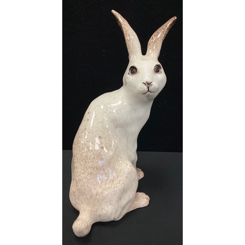 9 - A Winstanley ceramic sculpture of an Arctic Hare, glazed in mottled brown with glass eyes, size 6, p... 