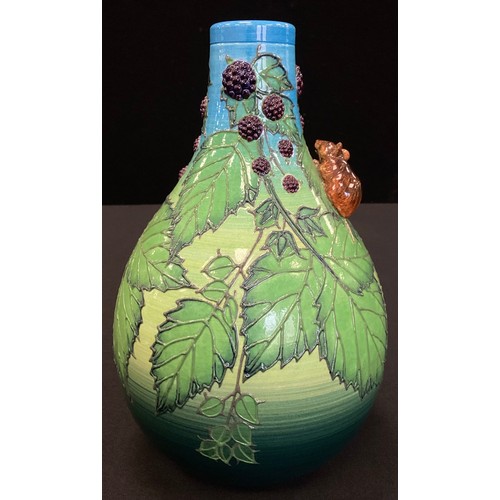 13 - A Sally Tuffin Dennis China Works limited edition bottle vase, tube lined and relief decorated with ... 