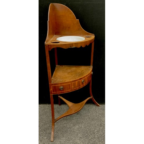 188 - A George III mahogany bow front corner washstand, c.1810