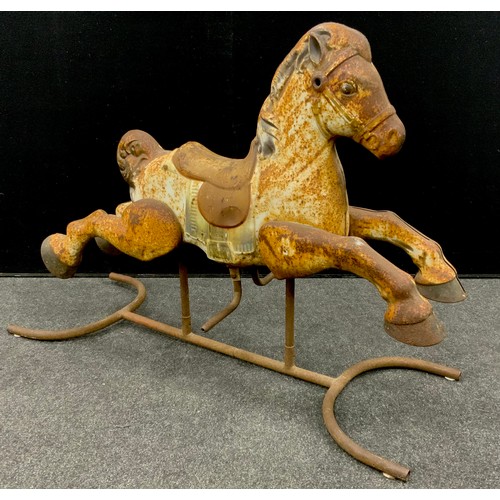 198 - A French pressed metal Rocking Horse, 75.5cm high x 99cm x 38.5cm.