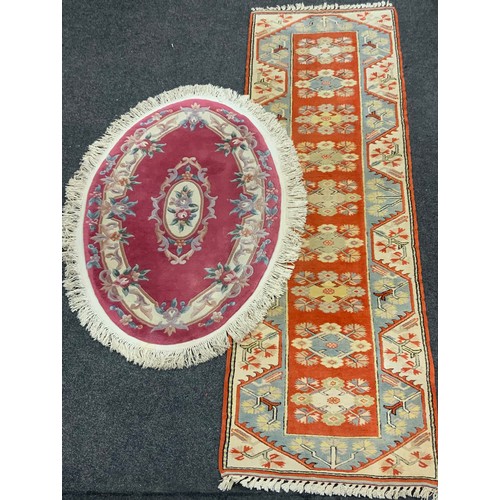 201 - A Milas Seccade Yolluk wool runner, approx 288cm x 84cm;  a Chinese oval rug, approx 150cm x 91cm (2... 